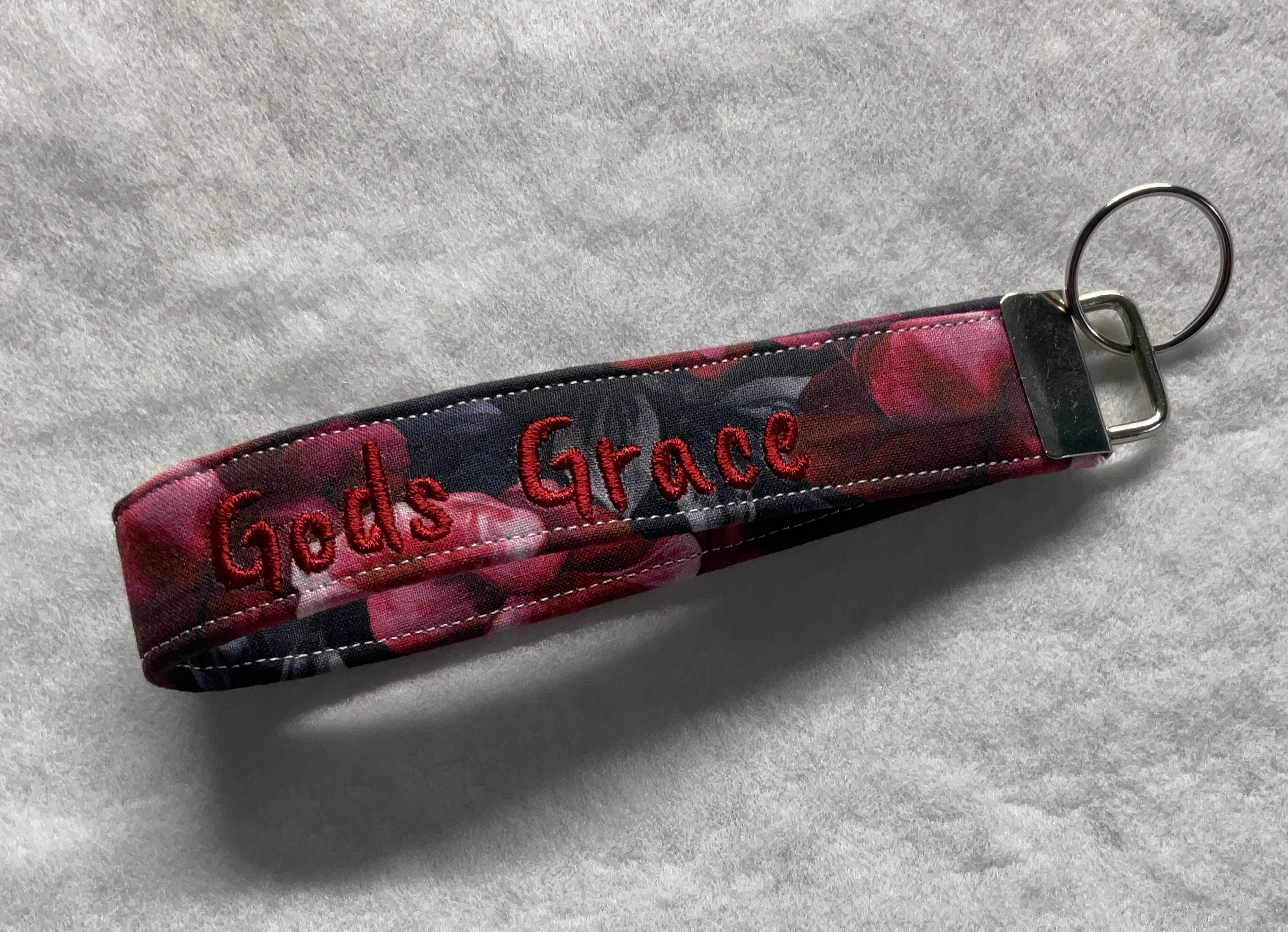 Keychain with 'God's Grace' embroidery