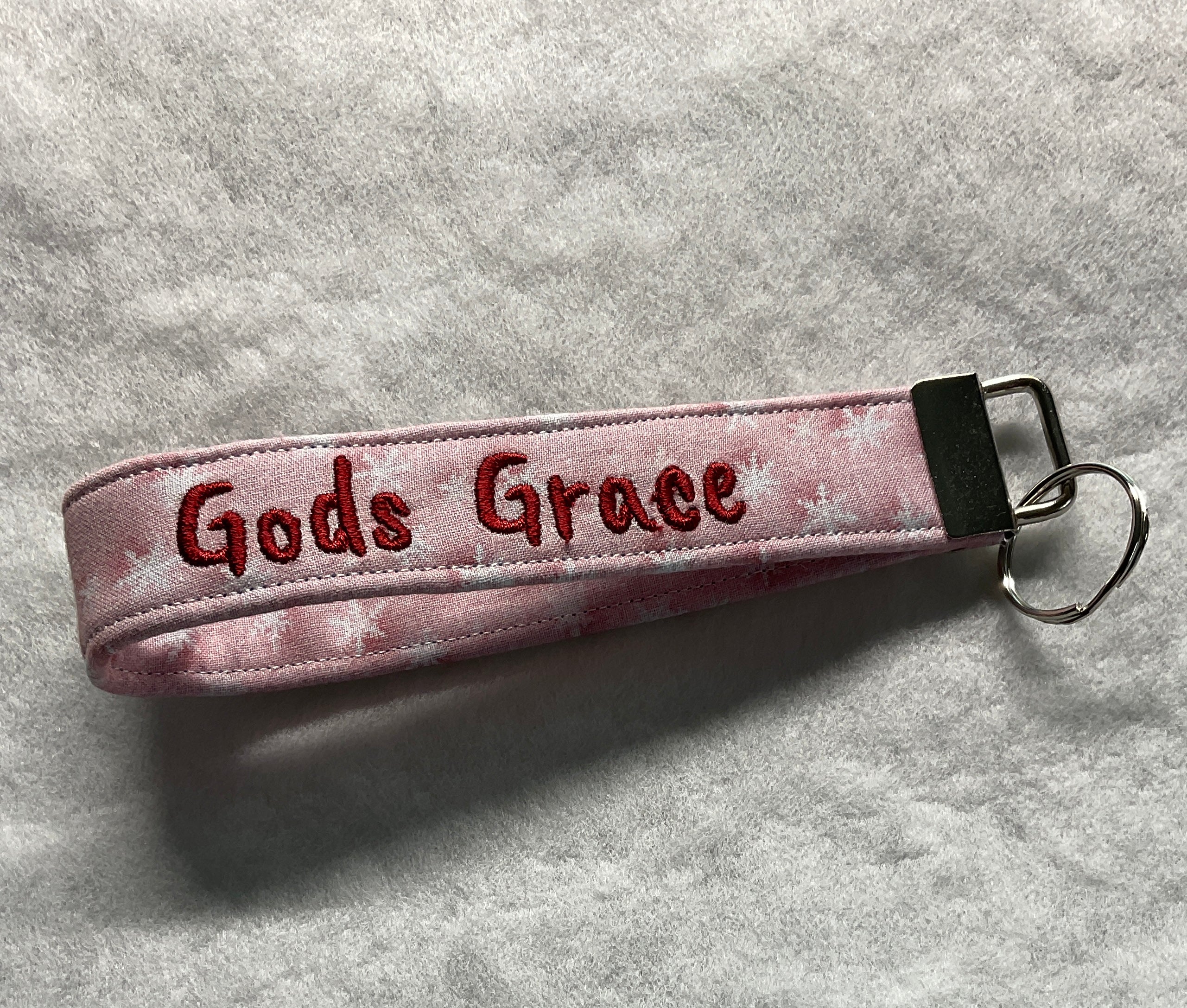 Pink keychain with 'Gods Grace' embroidery 