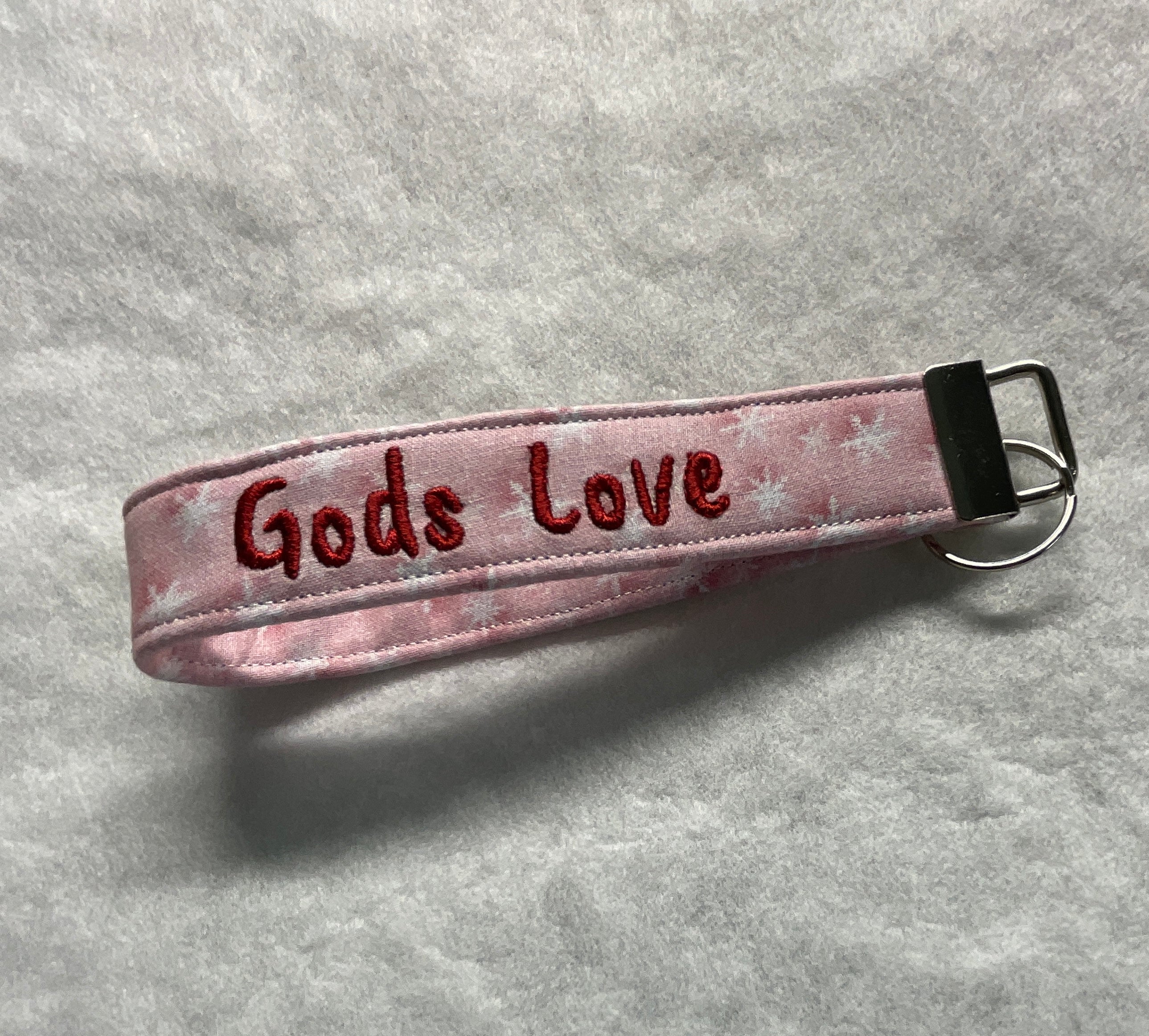Pink wristlet with 'Gods Love' embroidery 
