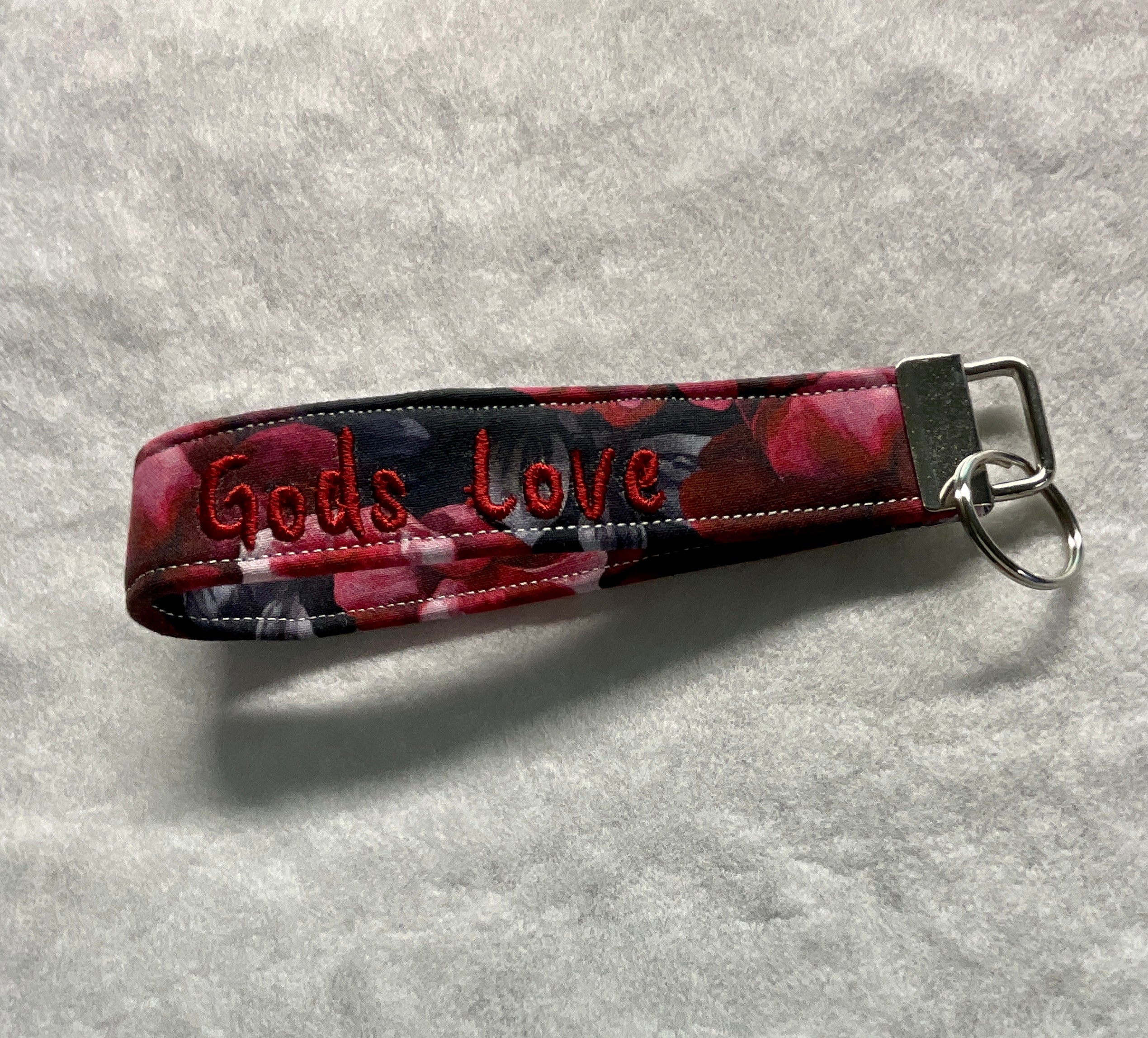 Keychain with floral pattern and 'God's Love' embroidery