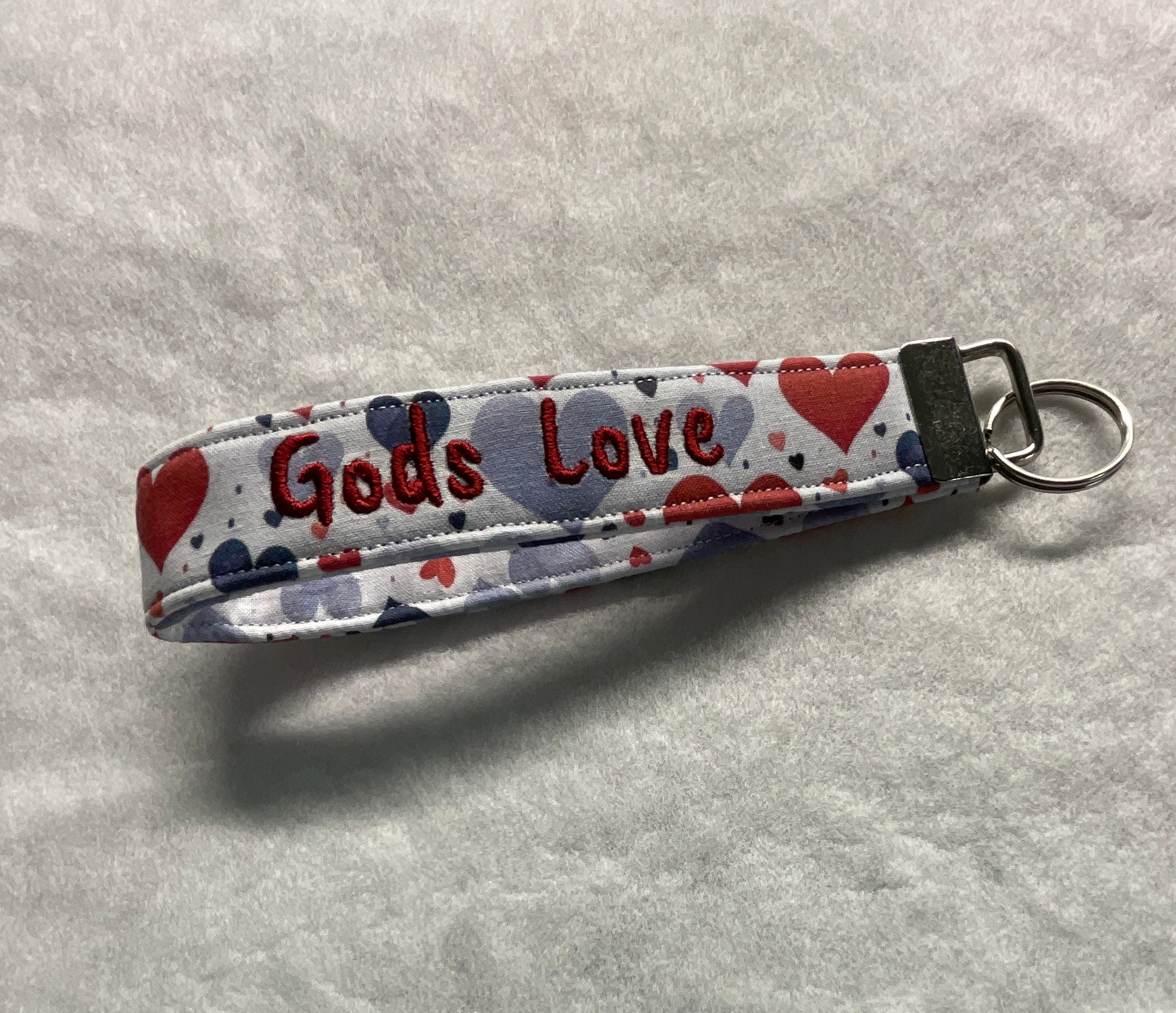 Keychain with 'Gods Love' embroidery and heart designs 