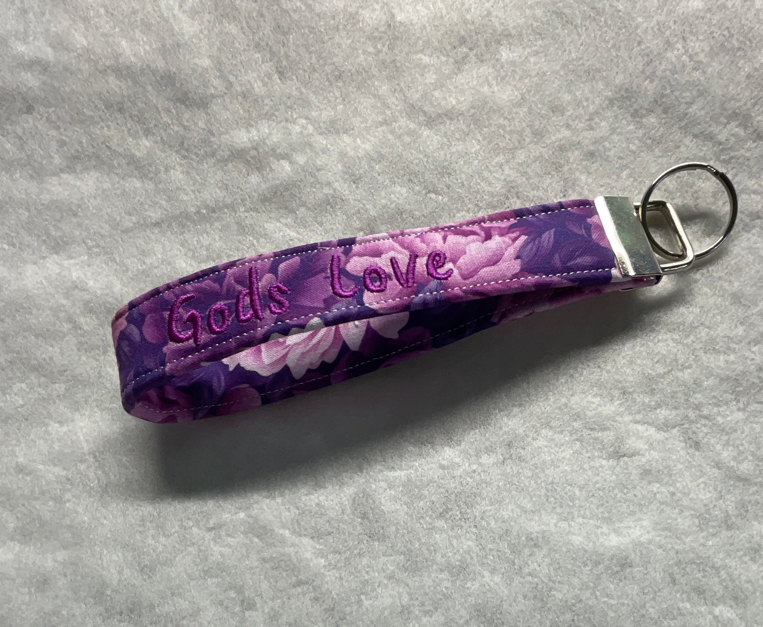 Purple floral keychain with 'God's Love' embroidery 