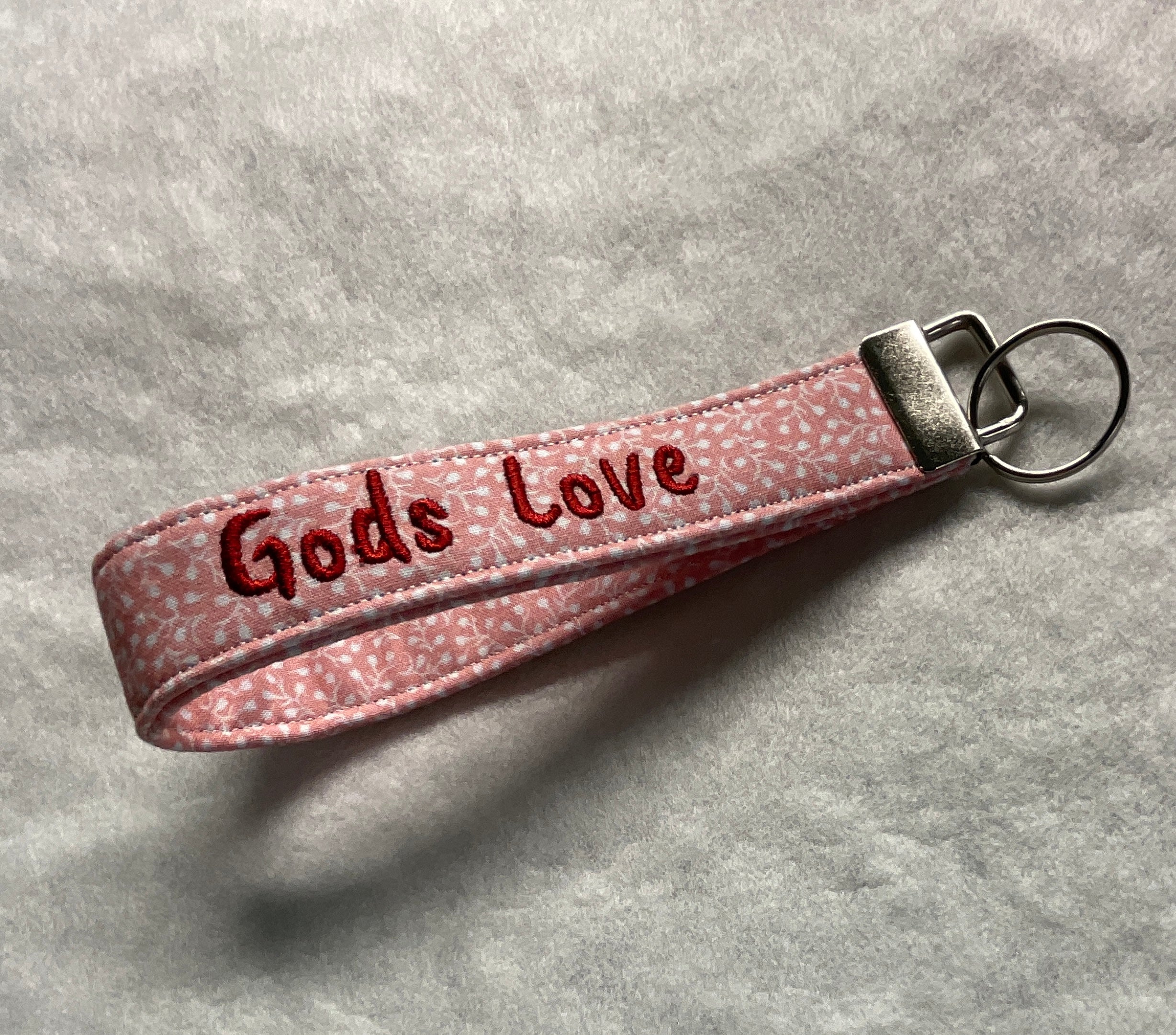 Pink keychain with 'Gods Love' embroidery